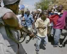U.S. Troops Again Under Fire in Haiti, Aristide to Visit Jamaica